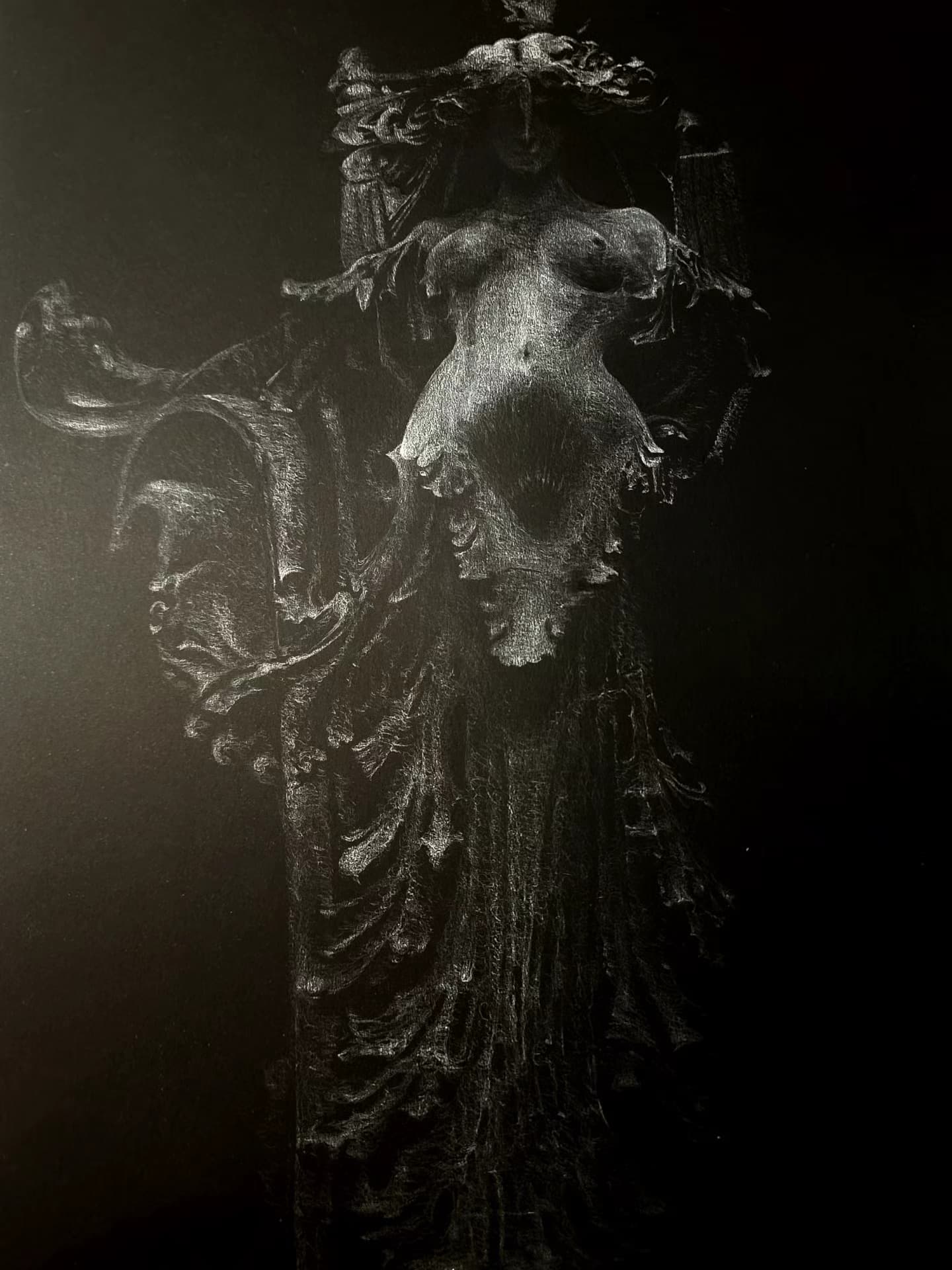 Robed figure with ornate headdress