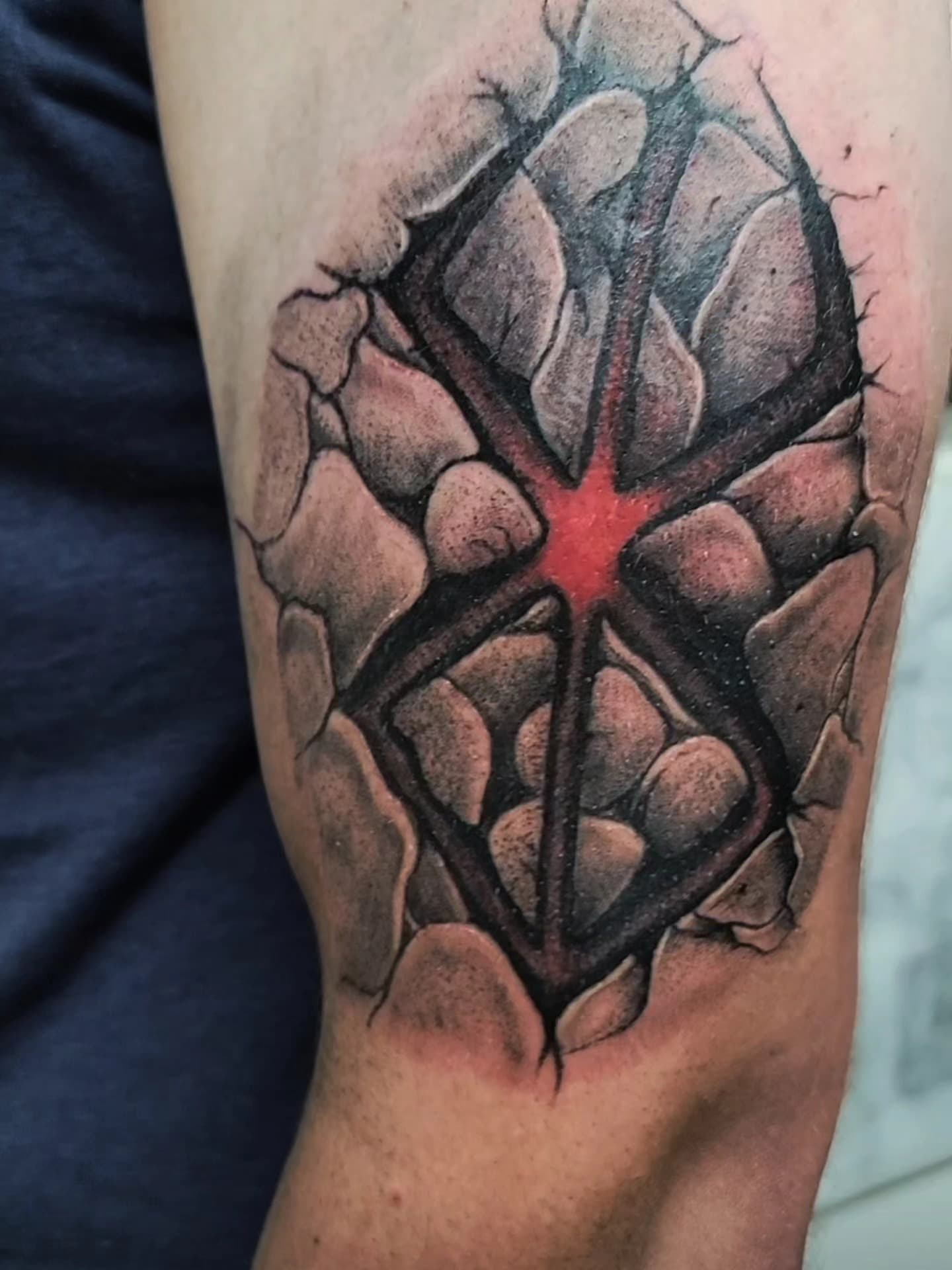 Anatomical heart tattoo with red highlight
