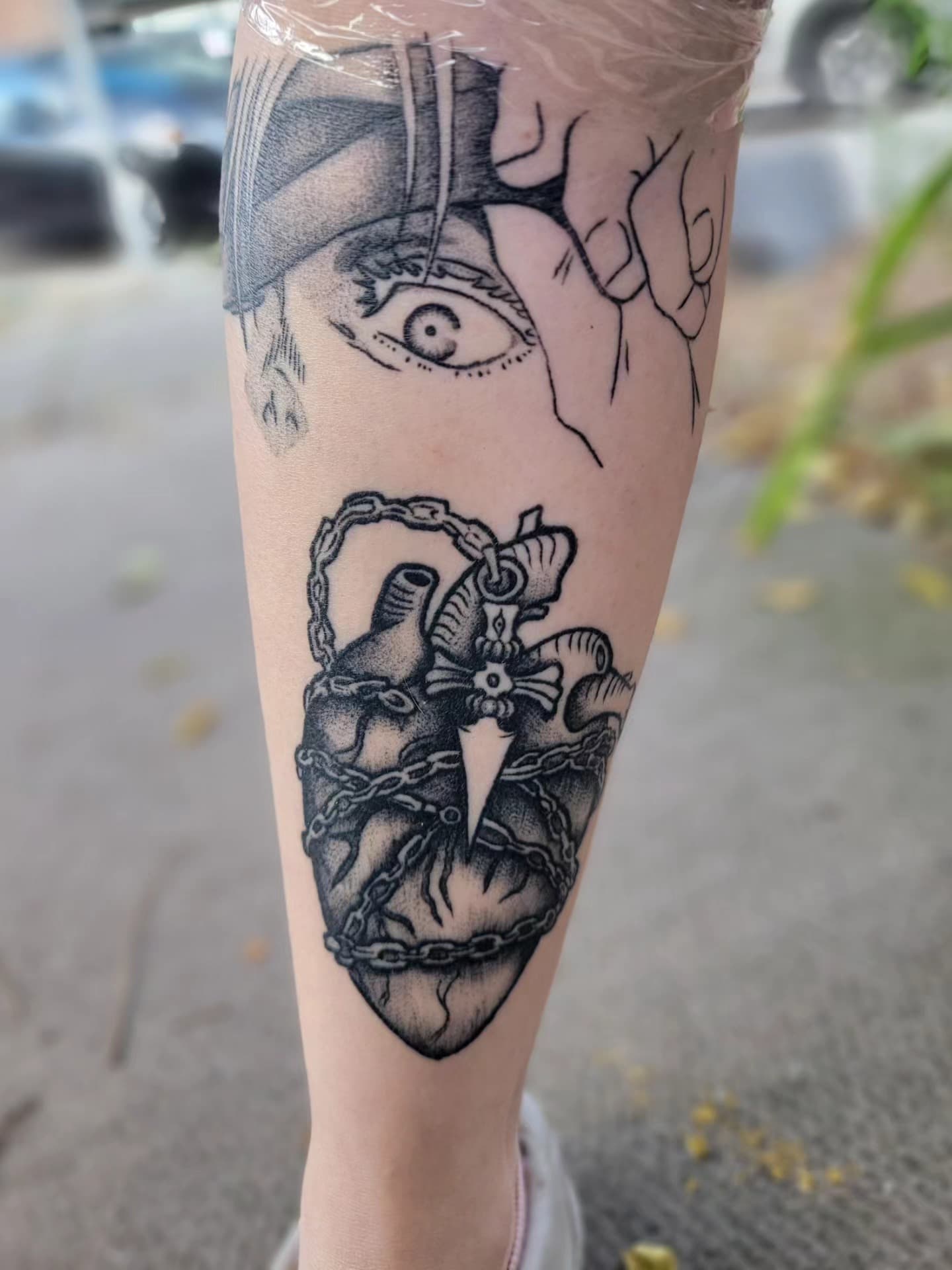 Eye and anatomical heart with tentacles tattoo