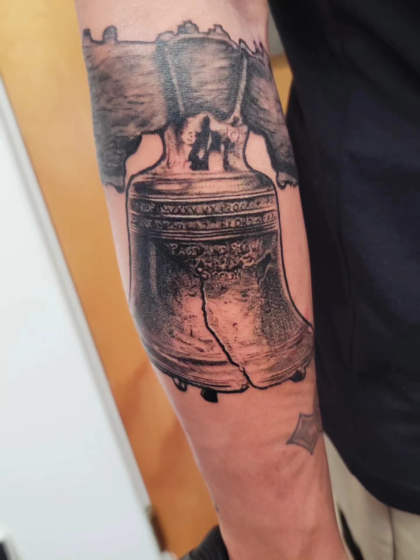 Open book with flame tattoo