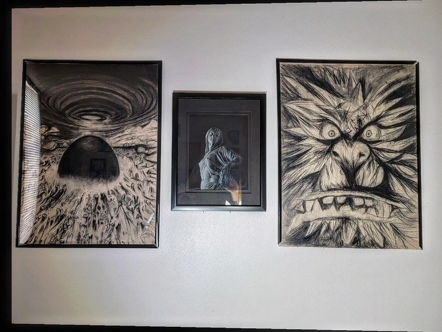 Framed ink drawings of creatures